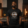Black male producer wearing a PhatsoundsBeats PSB logo t-shirt in a recording studio